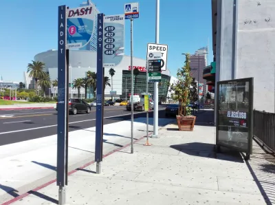 Bus stop in downtown Los Angeles with billboard and no bench or shelter