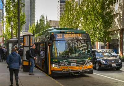 Bus stop with passengers and bus in downtown Seattle