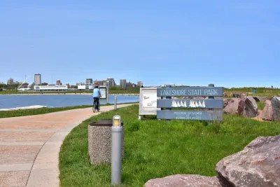 A cyclist on a path in Lakeshore State Park in Milwaukee Wisconsin
