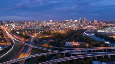 Pink light before morning dawn sun reflects on clouds over downtown Nashville TN