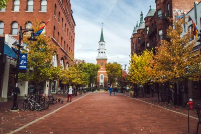 View down brick street in Burlington, Vermont with church at end