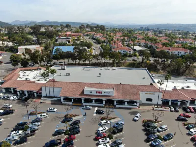 Aerial view of large store with parking and houses with beach in background in Rancho Penasquitos, California