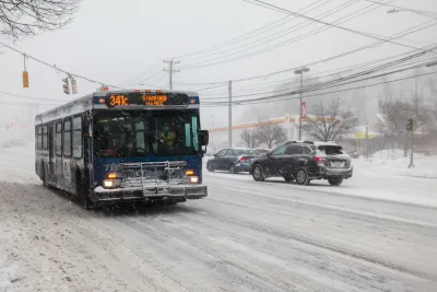 CTtransit bus driving through snowy street in Norwalk, Connecticut