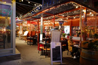 Italian restaurant outdoor dining patio with string lights in New York City