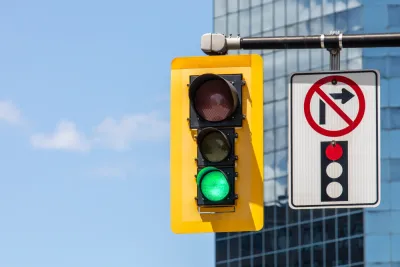 Stoplight with green light and "no right turn on red" pictograph on overhead signal