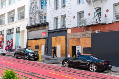 Vacant boarded-up storefronts along Powell Street in San Francisco, California.