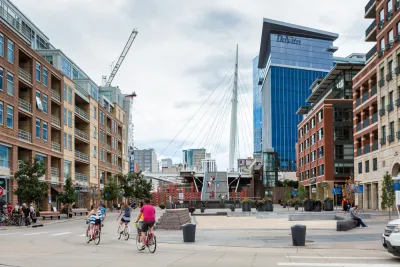 People on bikes in downtown Denver, Colorado