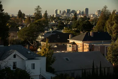 View of homes and Alameda, California skyline in background