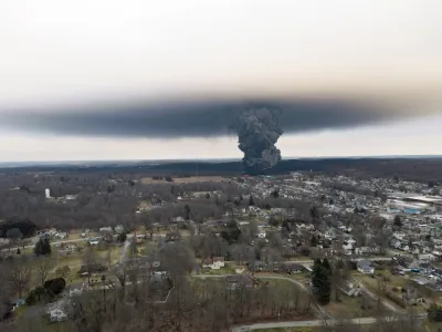 Gray chemical cloud seen from a distance from train derailment in Palestine, Ohio