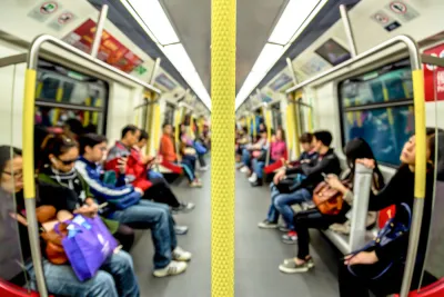 Blurry view of semi-crowded subway car