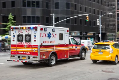 Ambulance driving down New York City street