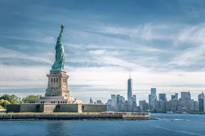 View of Statue of Liberty with New York City skyline in background