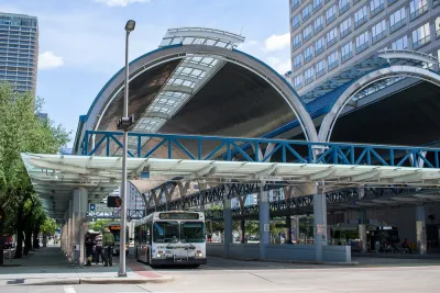 Downtown Houston covered bus station with one parked bus