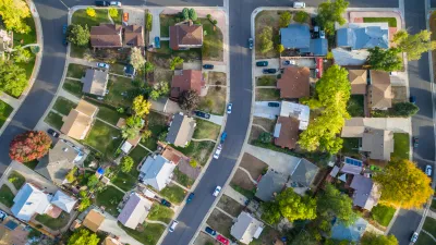 Aerial view of a single-family neighborhood with trees.