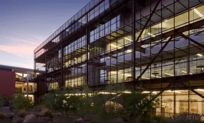 University of Arizona Campus building with glass windows and dark railings taken during dusk