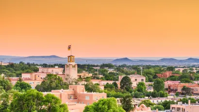 Aerial view of historic core of Santa Fe, New Mexico at dusk.