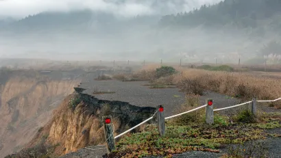 Collapsed road on coastal cliff in California