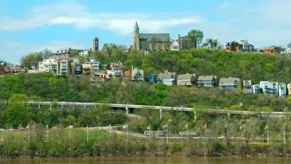 Holy Cross Immaculata Church sits atop Mt Adams in Cincinnati, as seen from across the Ohio River in Kentucky.