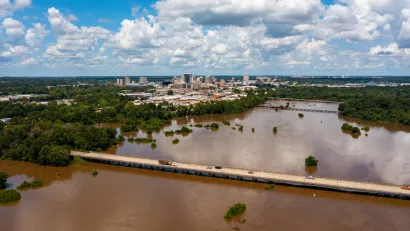 The Pearl River floods with brown near downtown Jackson, Mississippi.