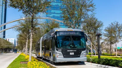 Silver Houston Metro bus on dedicated lane.