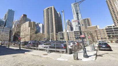 Google Street view of 250 Water Street parking lot with tall buildings in background