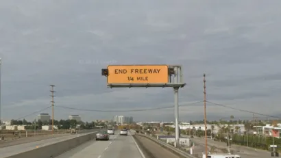 Google street view of yellow "End Freeway 1/4 mile" sign on 90 freeway in Los Angeles, California.