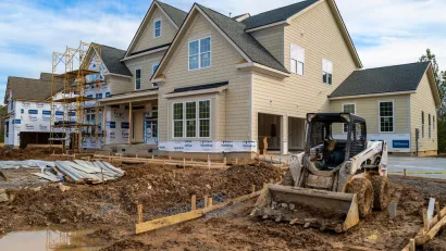 Single-family house with two-car garage under construction