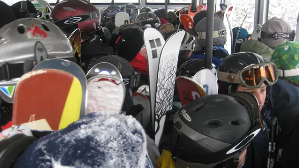 skiers on a tram