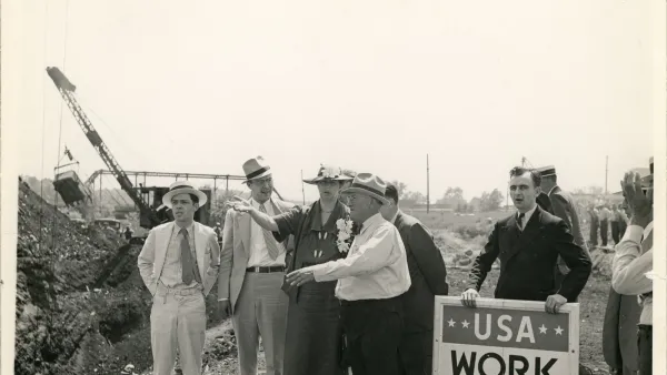 Eleanor Roosevelt talking with a project superintendent in Des Moines, Iowa. June 8, 1936. This project, sponsored by the Works Progress Administration, planned to convert a city dump into a water front park.
