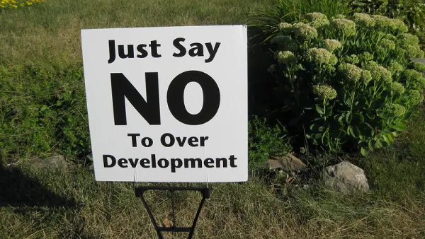 Clse-up of "Just Say No To Over Development" yard sign on green lawn