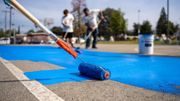 Paint roller coating basketball court with blue cooling coating