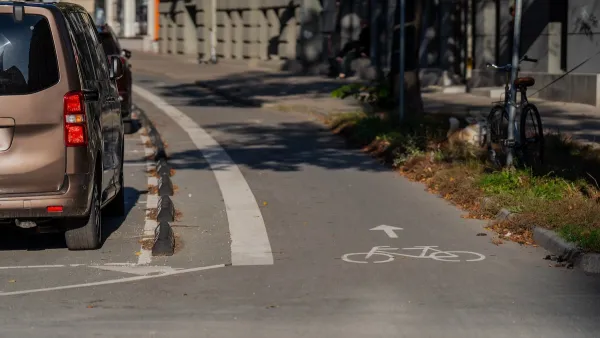 Parking protected bike lane in Riga, Latvia.
