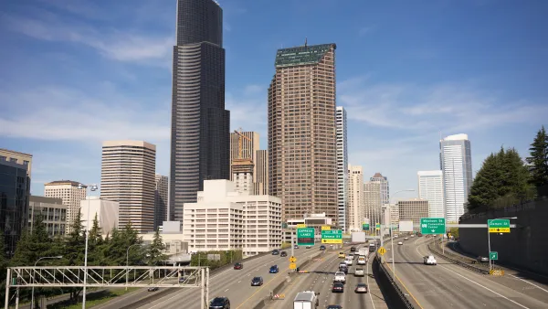 View of Interstate 5 with light traffic and downtown Seattle skyline in background