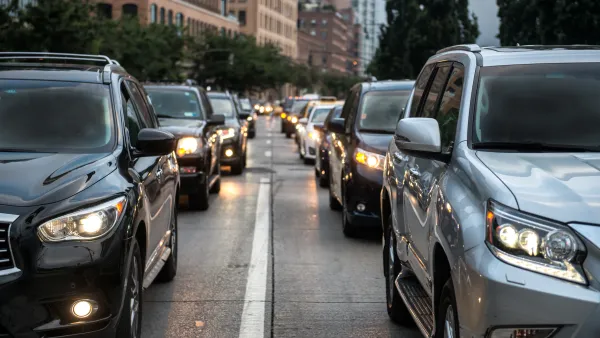 Close-up of black and gray SUVs in New York City traffic