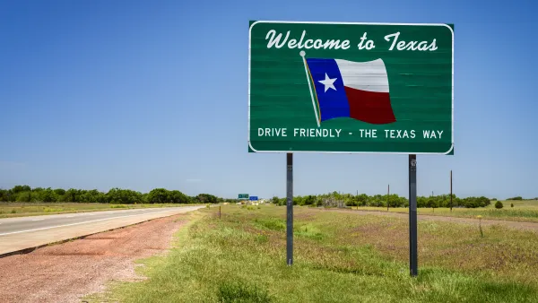 "Welcome to Texas" road sign with Texas flag and "Drive Friendly - the Texas way" slogan