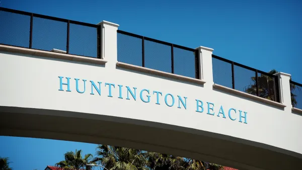 'Huntington Beach' sign on pedestrian bridge over Pacific Coast Highway.
