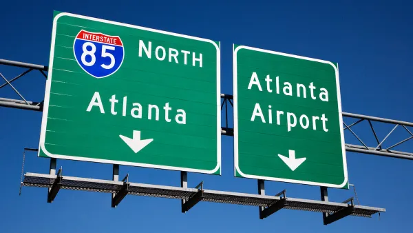 Green freeway signs for Atlanta and Atlanta airport on Interstate 85.