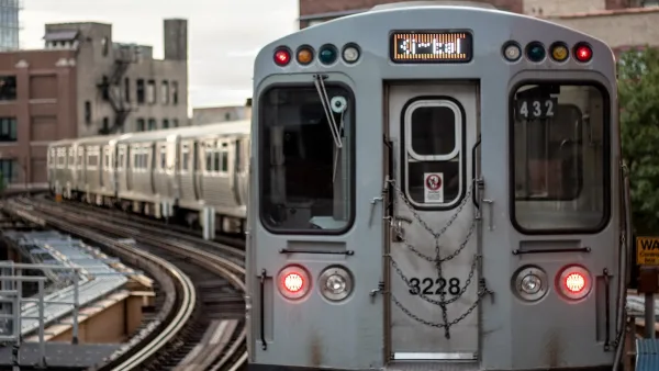 Silver train on elevated rail in Chicago, Illinois.