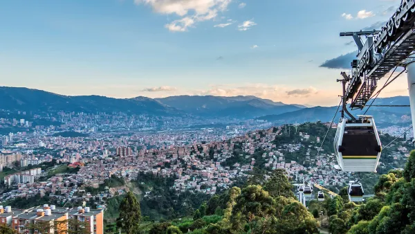 Aerial gondola car in the air overlooking the city of Medellin, Colombia.