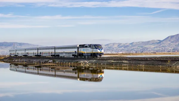 Amtrak train passing over bridge on Alviso Marsh near San Jose, California.