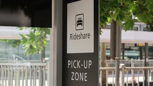 Black and white Rideshare Pick-Up Zone sign