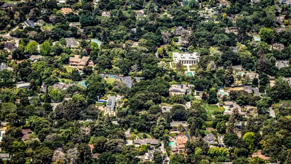 Aerial view of large houses in large yards surrounded by trees in Palo Alto, California