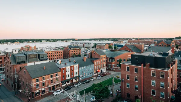 Aerial view of mid-rise brick buildings in Portland, Maine on waterfront.