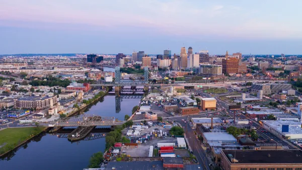 Aerial view of Newwark, New Jersey at sunset with river in foreground.