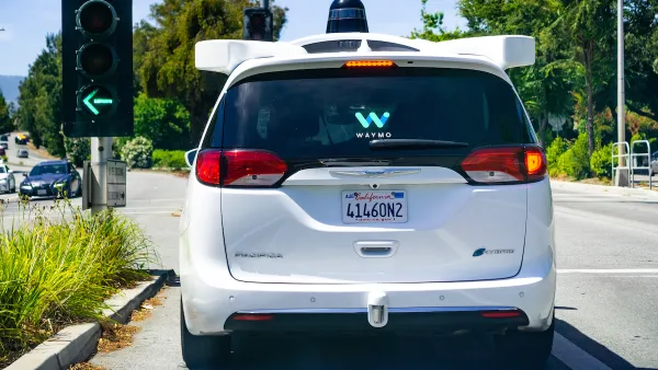 View from rear of white Waymo autonomous taxi van in Mountain View, California