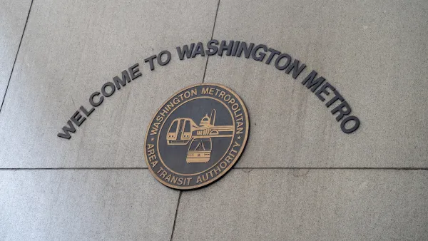 Sign on concrete wall "Welcome to Washington Metro" with WMATA seal.