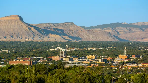 View of downtown Grand Junction, Colorado with mesas in background.