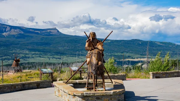 Blackfoot memorial statue in Glacier National Park of Native American sitting on horse