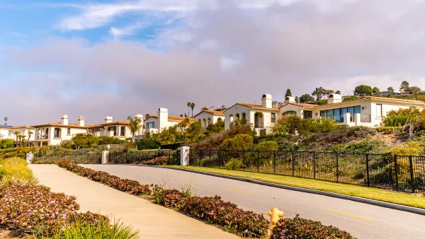 Row of white Spanish Revival-style homes in Torrance, California.