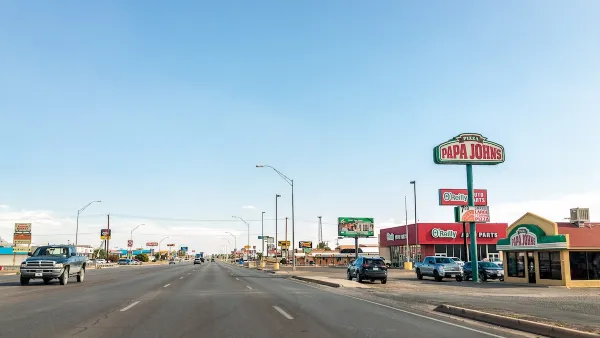 Six-lane road with fast food and pizza restaurants in Alamogordo, New Mexico.